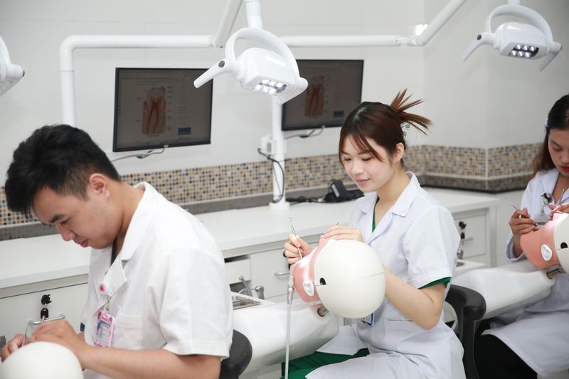 Dental students practicing clinical skills in training lab